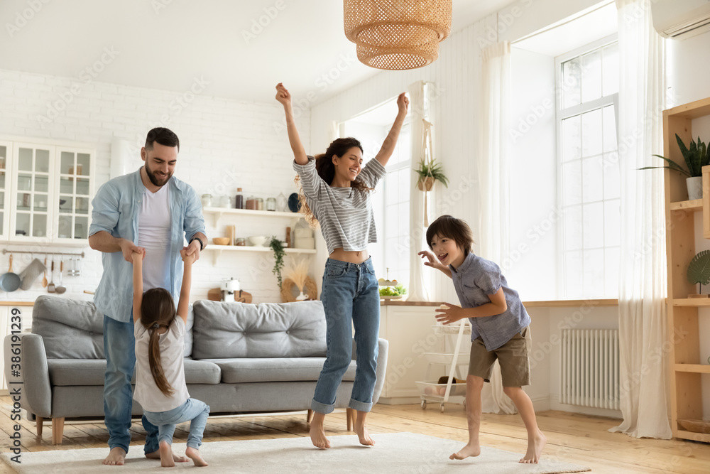 Family dancing in their home with double glazed windows