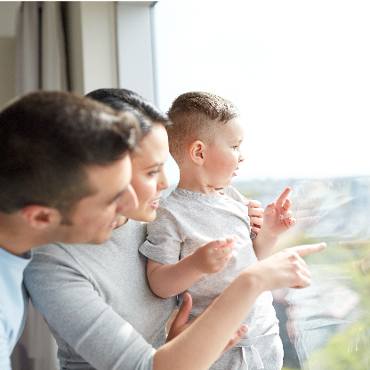 Family looking out of double glazed windows
