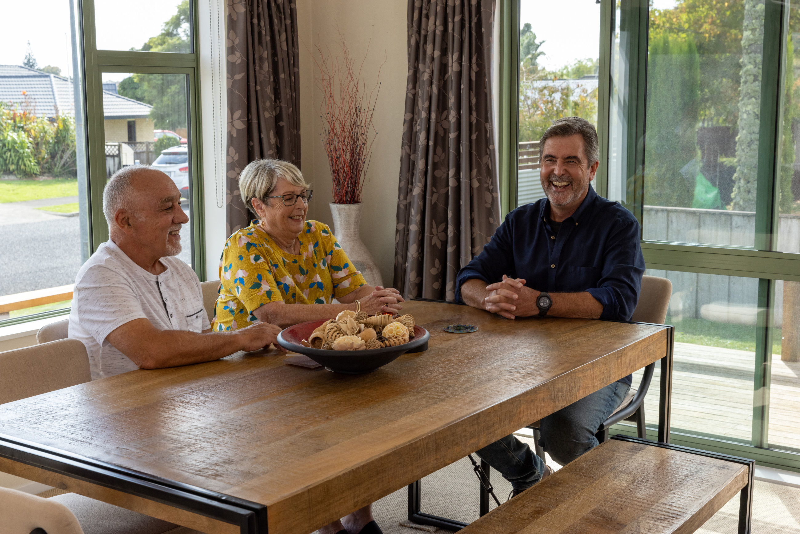 People discussing double-glazing windows for a home.