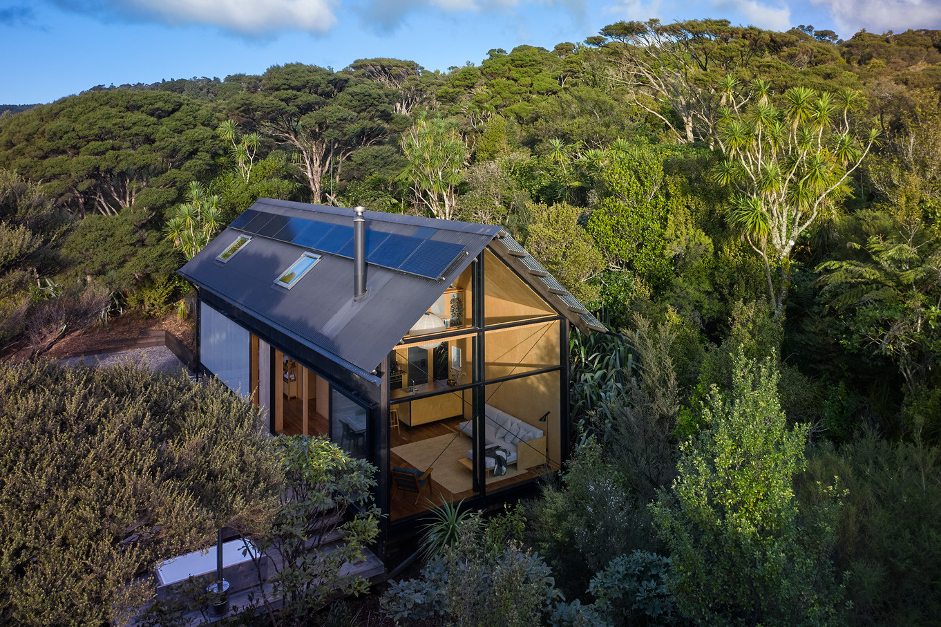 cabin in forest featuring double glazed windows