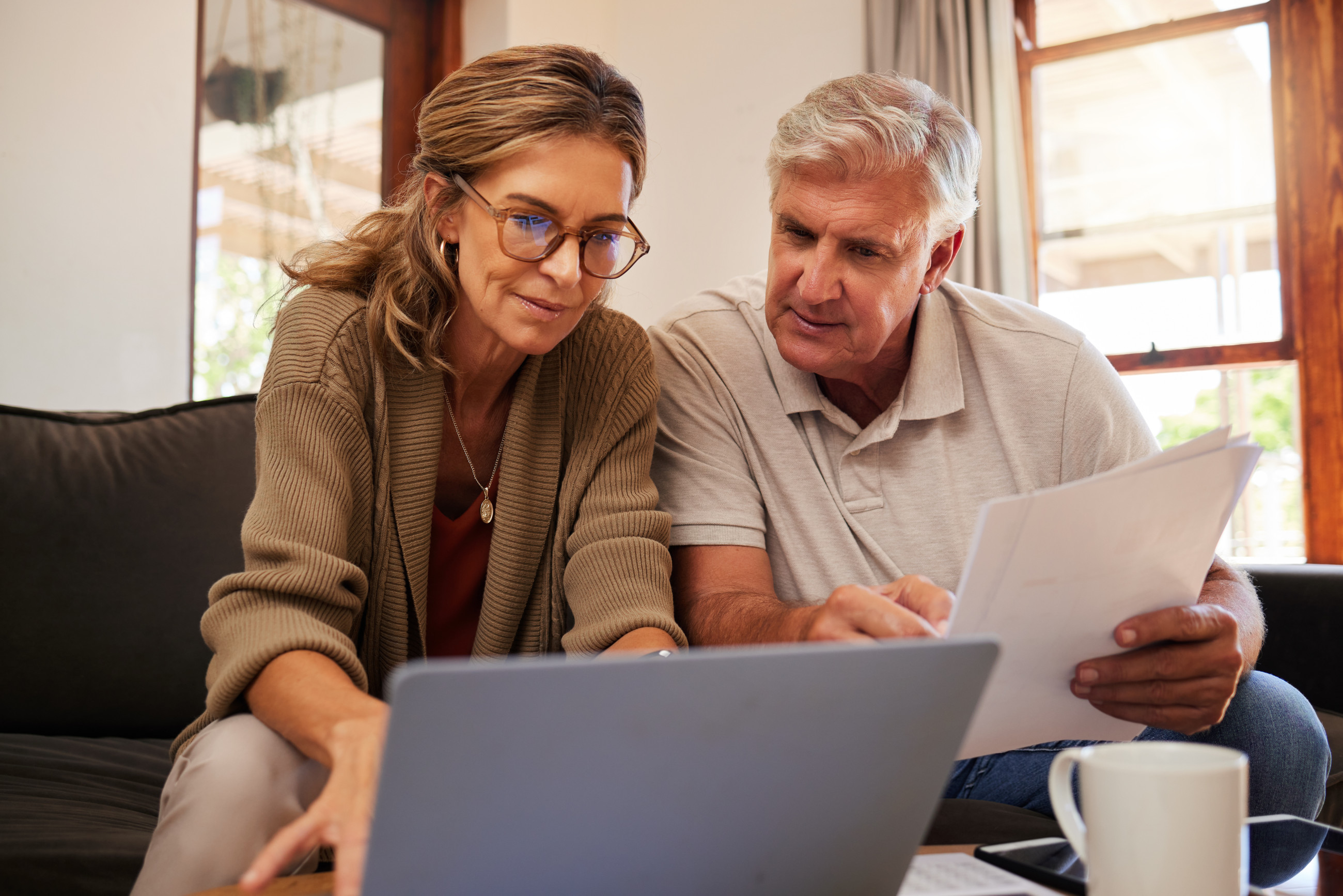 A couple discussing double-glazing windows for a home.