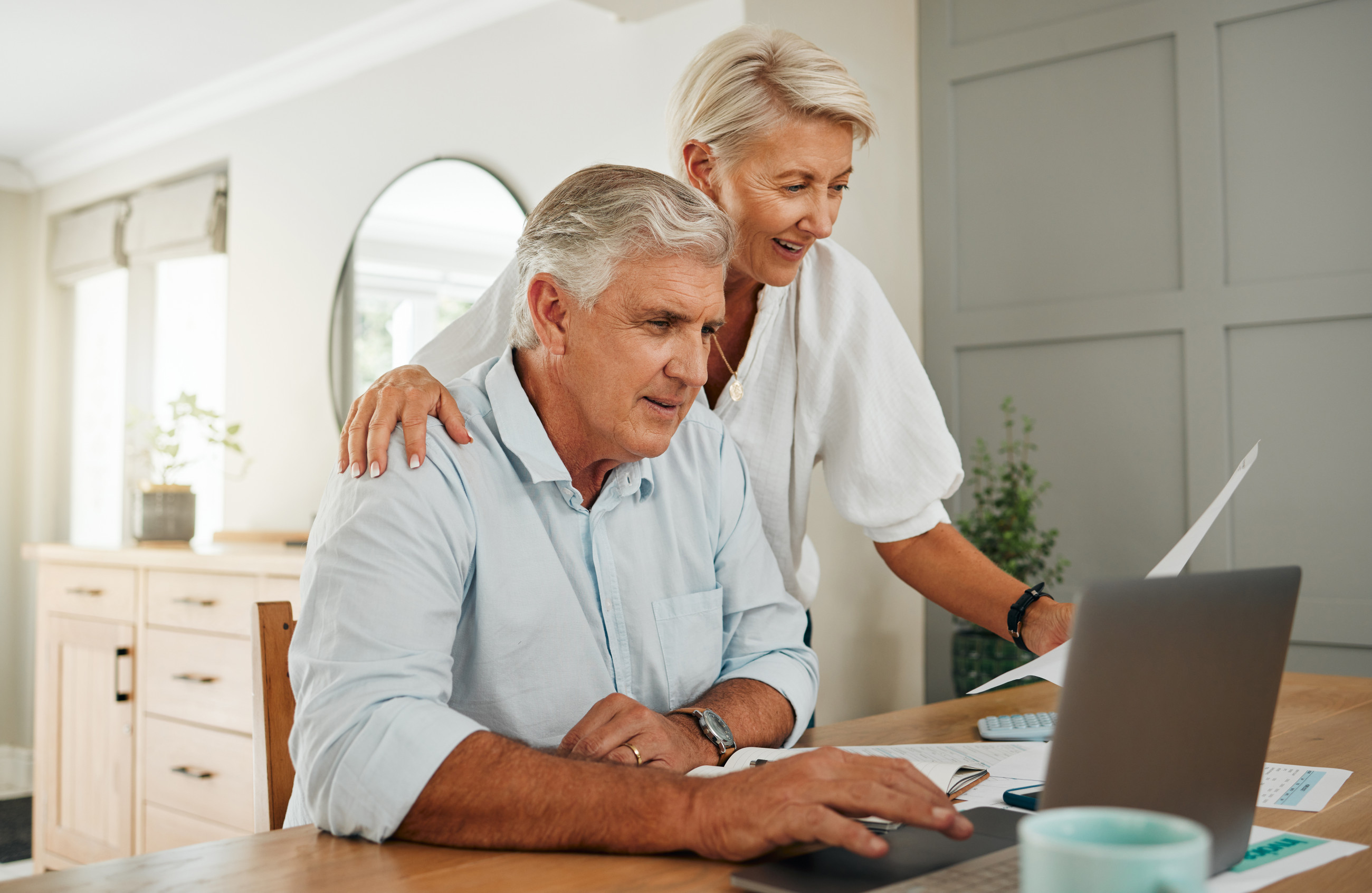 Couple talking in home, while looking at double glazed windows online